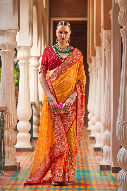 Persimmon Orange Leheriya Style Soft Georgette Saree with Heavy Embroidered Border