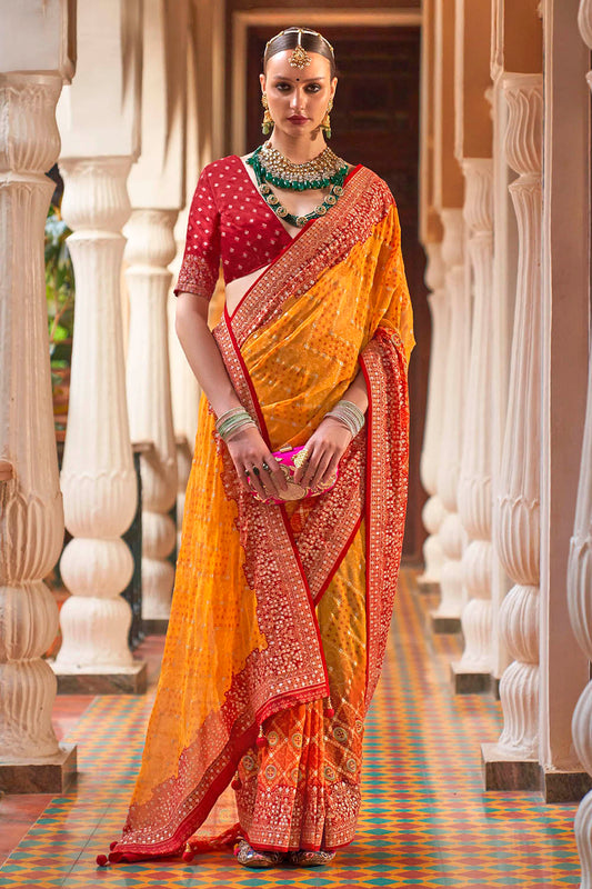 Persimmon Orange Leheriya Style Soft Georgette Saree with Heavy Embroidered Border