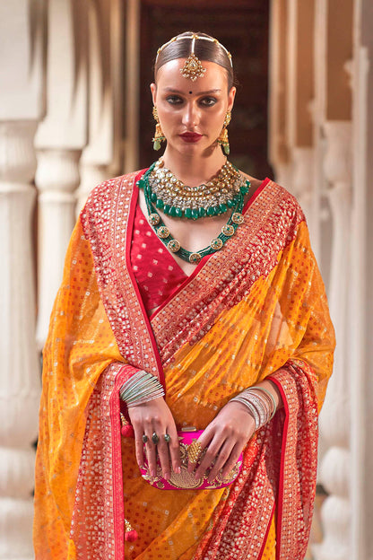 Persimmon Orange Leheriya Style Soft Georgette Saree with Heavy Embroidered Border