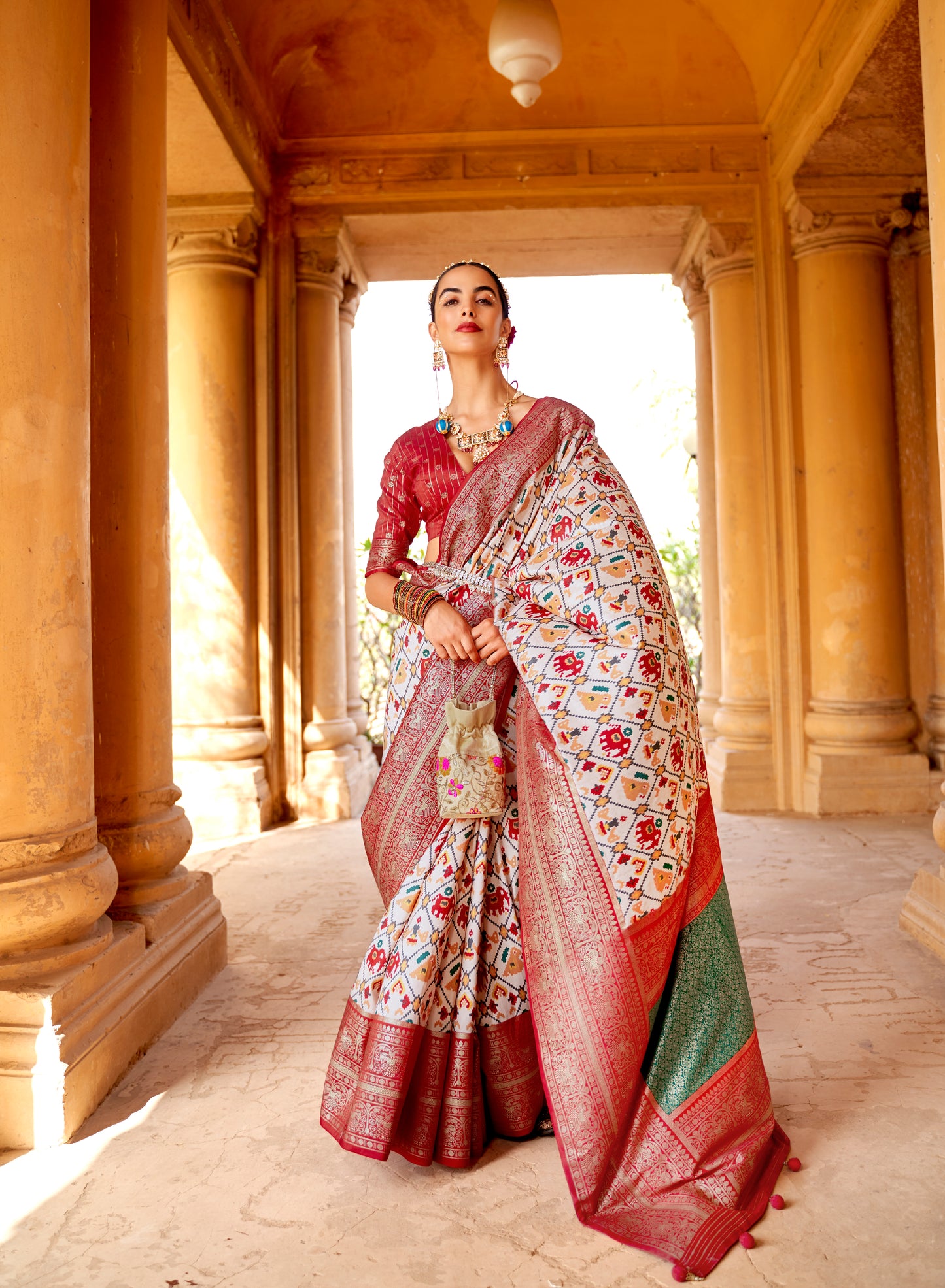 White with Red Navratna Patola Style Saree with Tessles