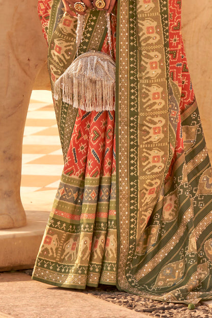 Coral Orange Woven Patola Designer Saree with Elephant Border